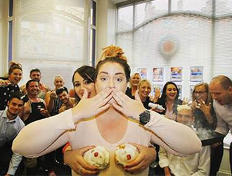 women holding cupcake over her front upper body 